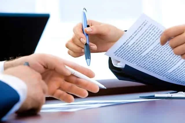 Close-up of a legal document being signed, symbolizing the commitment to legal excellence at Kevin R. Hansen's Las Vegas Law Office