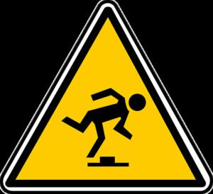 Icono de un hombre tropezando con un obstáculo, que simboliza los casos de accidentes por resbalones y caídas manejados por Kevin R. Hansen, abogado de lesiones personales de Las Vegas.