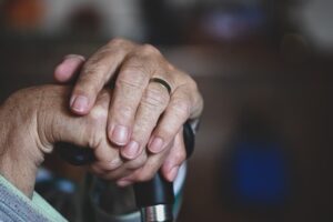 Image of senior hands holding a cane