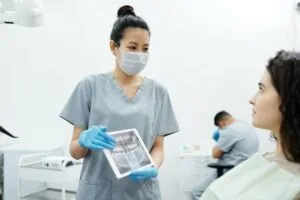 Image showing medical provider providing care to patient in a hospital after an injury