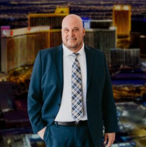 Motorcycle Accident Lawyer Kevin R. Hansen against a backdrop of the Las Vegas Valley.