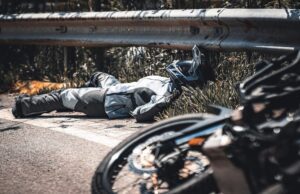 Injured motorcycle rider on the side of the road